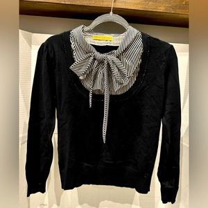 Black sweater with ruffles blouse insert